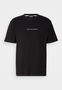 Black cotton t-shirt with a crew neckline, short sleeves, and white embroidered text "SCOTCH & SODA" on the front. Smooth texture.