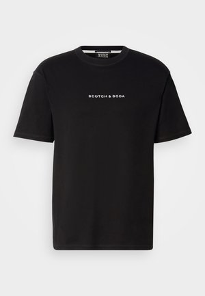 Black cotton t-shirt with a crew neckline, short sleeves, and white embroidered text "SCOTCH & SODA" on the front. Smooth texture.