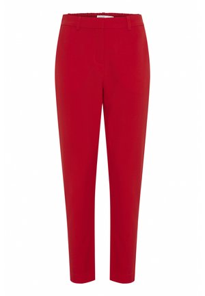 Pantaloni rossi slim fit, con una texture liscia, cintura elastica e senza hardware o tasche visibili. Design moderno e su misura.