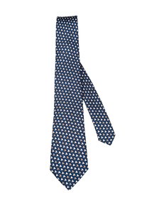 Tumesinine lips, millel on korduv muster väikestest valgetest ja beežidest kolmnurkadest, lamab tasasel valgel taustal.