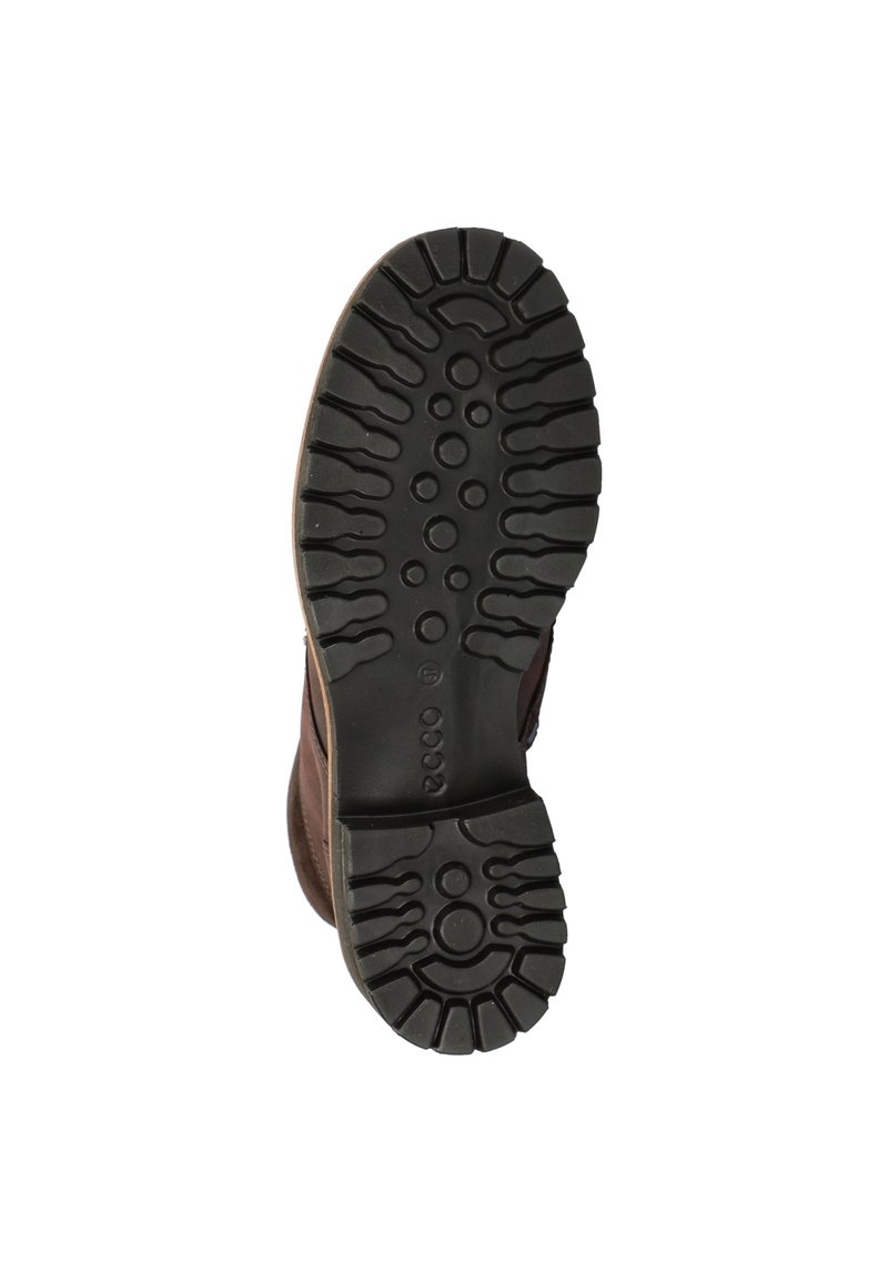 Suela de bota de cuero marrón con una banda de rodadura de goma negra texturizada. Presenta patrones circulares y lineales para un mejor agarre. Construcción robusta.