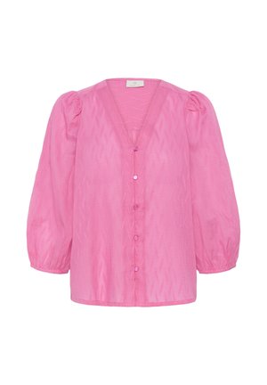 Blouse rose vif à manches longues avec épaules bouffantes, col en V, cinq boutons sur le devant et un subtil motif en zigzag texturé.