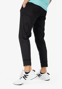 Spyder Pantalones deportivos - black