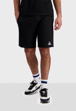 ESSENTIELS - Shorts - black