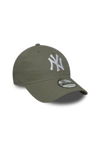 Olive green adjustable baseball cap with white embroidered "NY" logo. Features a structured crown and curved brim. 9TWENTY label visible.