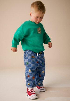 Next, Avar lõikega teksad - mid blue checkerboard with all over embroidery
