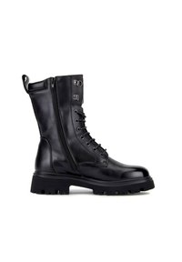 Stivale alla caviglia in pelle nera con lacci frontali, cerniera laterale, suola in gomma chunky e linguetta sul retro. Texture liscia, design in stile combat.
