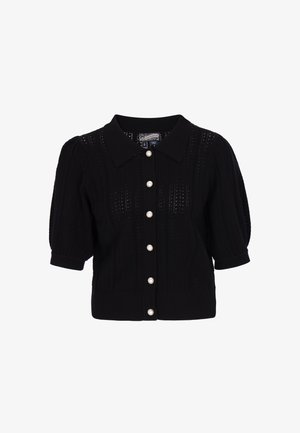 Black knitted cardigan with a collared neckline, short puffed sleeves, and six large pearl buttons down the front. Textured fabric with open stitching.