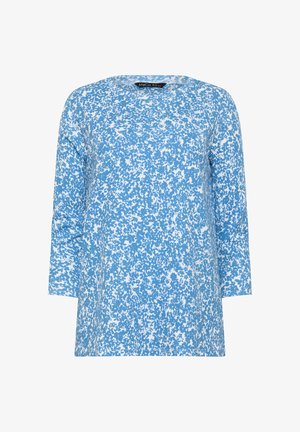 Top de manga larga azul y blanca con un patrón floral abstracto denso y un escote redondo.