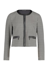 Veste noir et blanc recadrée avec un motif en grille texturé. Caractéristiques : col rond, fermeture éclair frontale et deux poches zippées.