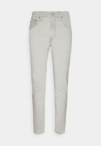 Ljust grå denimjeans med smal passform, utrustade med en klassisk femfickdesign, diskreta sömmar och knappstängning.