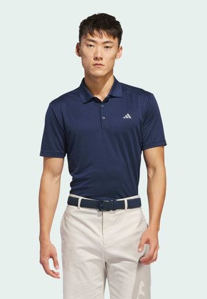 Navy blue polo shirt made of smooth fabric with short sleeves and a three-button collar. Features a subtle logo on the left chest.