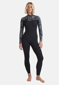Full-length wetsuit in navy, featuring long sleeves with floral print accents. Made from flexible material, includes knee pads for durability.