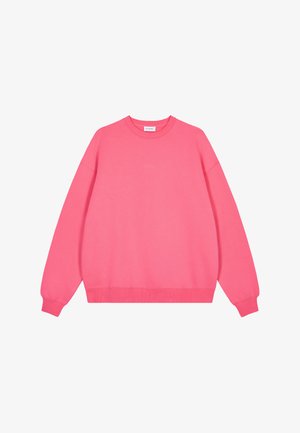Pink sweatshirt made of soft fabric, featuring a round neckline, long sleeves, and ribbed hem and cuffs for a relaxed fit.