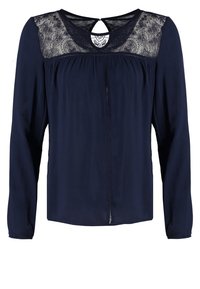 Blouse bleu marine à manches longues avec empiècement en dentelle et encolure ronde avec une petite ouverture goutte d'eau dans le dos.