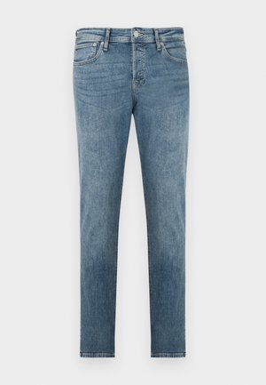 Lys blå denimjeans med smal passform, design med fem lommer og kontrastsøm. Lukket med metallknapp og glidelås.