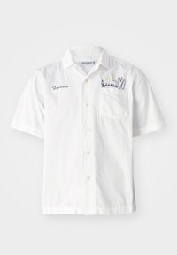 Short-sleeve white shirt made of cotton, featuring a chest pocket and embroidered floral design with utensils. "Terrice" is embroidered on the front.