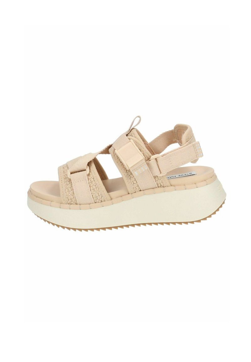 Helle beige Sandale mit Textilriemen und einer verstellbaren Schnalle. Verfügt über eine dicke weiße Sohle mit strukturierter Oberfläche und Flexrillen.