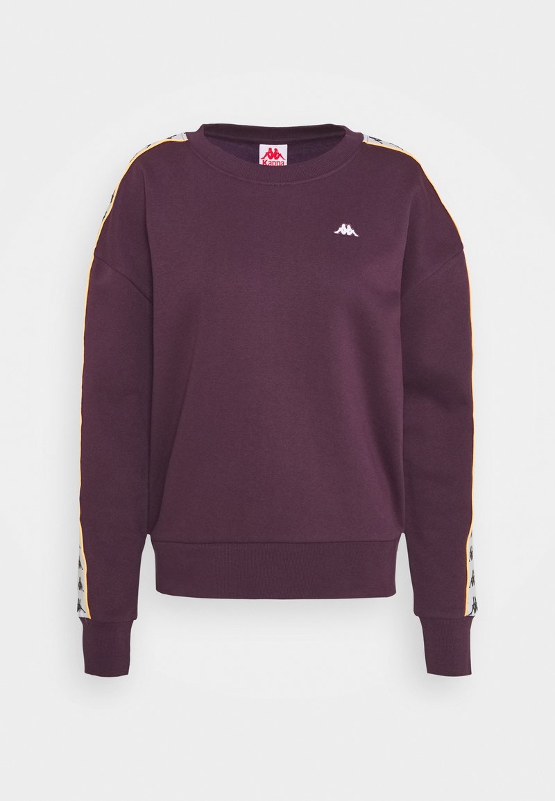 Sweat-shirt violet à manches longues avec bande de logo blanche et noire sur les manches et petit logo blanc sur la poitrine, poignets et ourlet côtelés.