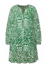Chemise boutonnée verte et blanche à motifs, à manches longues, avec un décolleté en V et une coupe ample. La texture du tissu semble légère et respirante.
