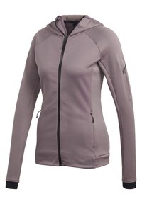 Chaqueta con capucha de tejido púrpura claro con textura de cuadrícula, cierre de cremallera negro y bolsillos laterales con cremallera; presenta elementos de diseño deportivo.