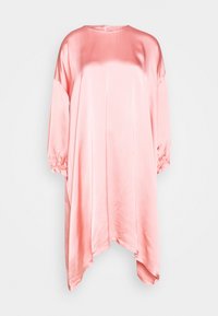 Loose-fitting pink satin dress with long balloon sleeves and asymmetrical hem hanging against a white background.