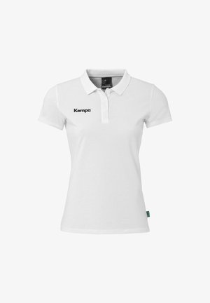 Witte poloshirt van katoen met een kraag en korte mouwen. Bevat een zwart "Kempa" logo aan de linkerkant.