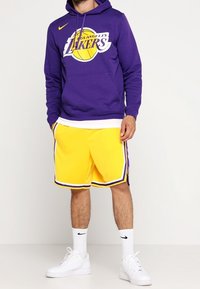 Nike Performance Träningsshorts - yellow