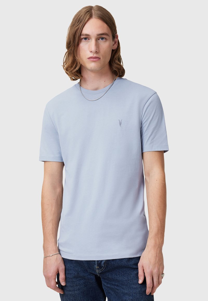 Light blue short-sleeve T-shirt in soft cotton, features a minimalist design with a small embroidered logo on the chest, and a classic crew neckline.