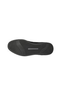 Black rubber shoe sole featuring textured grip patterns and a raised logo. Designed for traction with rounded edges and a flexible shape.
