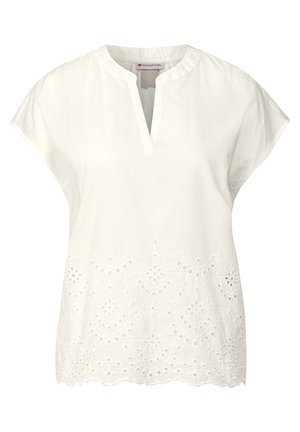 Witte blouse met korte mouwen, voorzien van een notch halslijn en geborduurde oogjes langs de zoom, met een gegolfde rand.