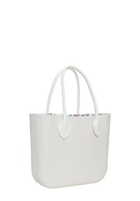 Witte tote bag met een gladde textuur, ronde hoeken en bladeren-vormige handvatten. Heeft een kleurrijke, patroonvoering aan de binnenkant. O Bag-logo reliëf.