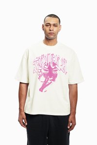 White oversized t-shirt featuring a large pink graphic print of a face with a cigarette, round neckline, short sleeves, and relaxed fit.