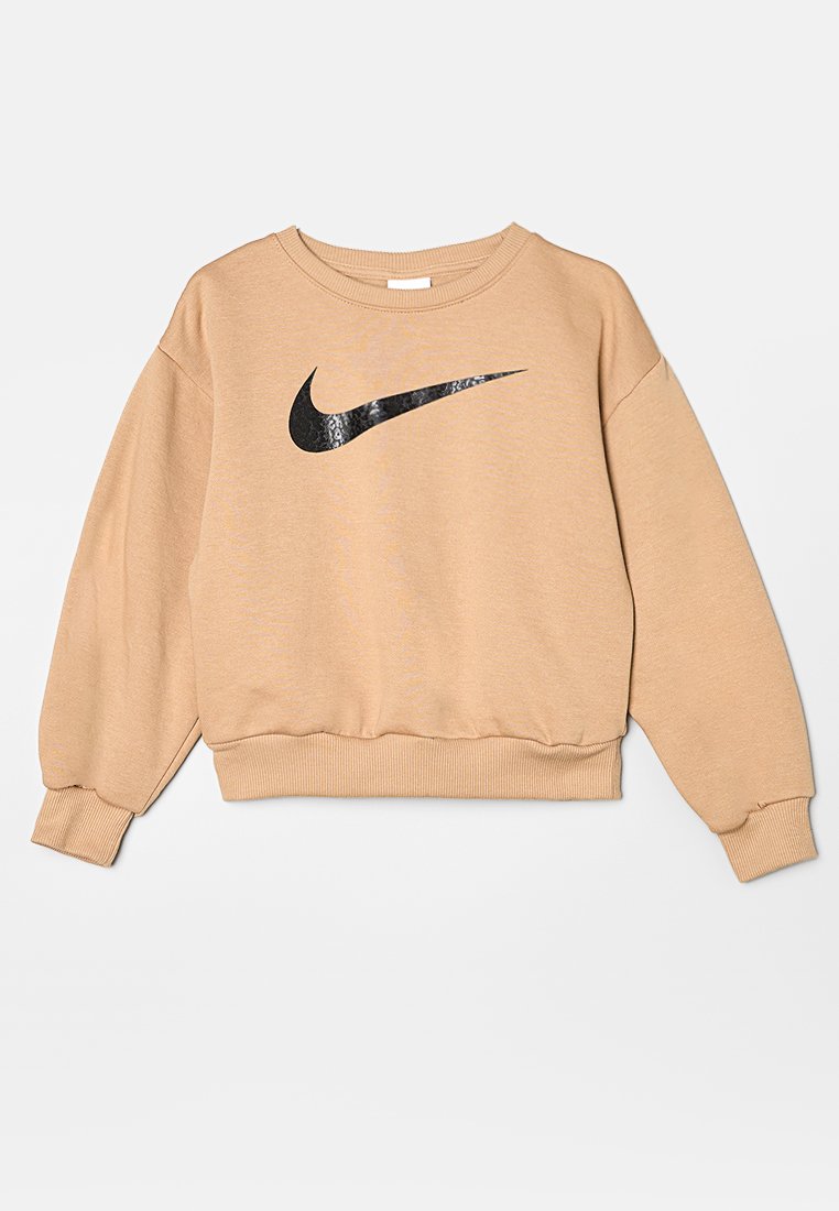 Sudadera beige clara hecha de una tela suave, con un logo negro de Nike en la parte delantera. Corte relajado con puños y dobladillo acanalados.