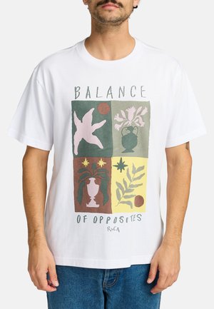 White cotton t-shirt featuring a geometric print with pastel colors, floral motifs, and text reading "BALANCE OF OPPOSITES" at the front.