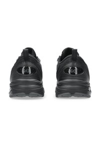 Black running shoes featuring a mesh upper, rounded heel, thick rubber sole, and "Gel" logo accents on the heel for cushioning.