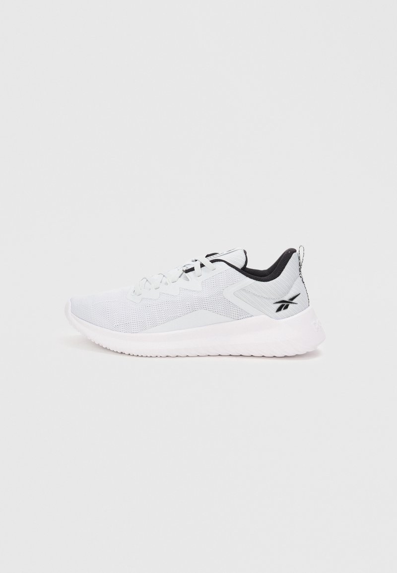 Lightweight athletic shoe in white mesh material with black accents. Features lace-up closure, a thick white sole, and rear pull tab.