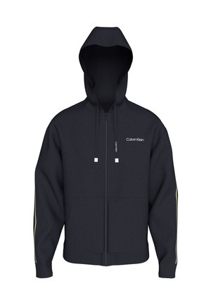 Μαύρο φούτερ με φερμουάρ και κορδόνια, μικρό λευκό λογότυπο Calvin Klein στο στήθος και διακριτικές κίτρινες ρίγες στα μανίκια.