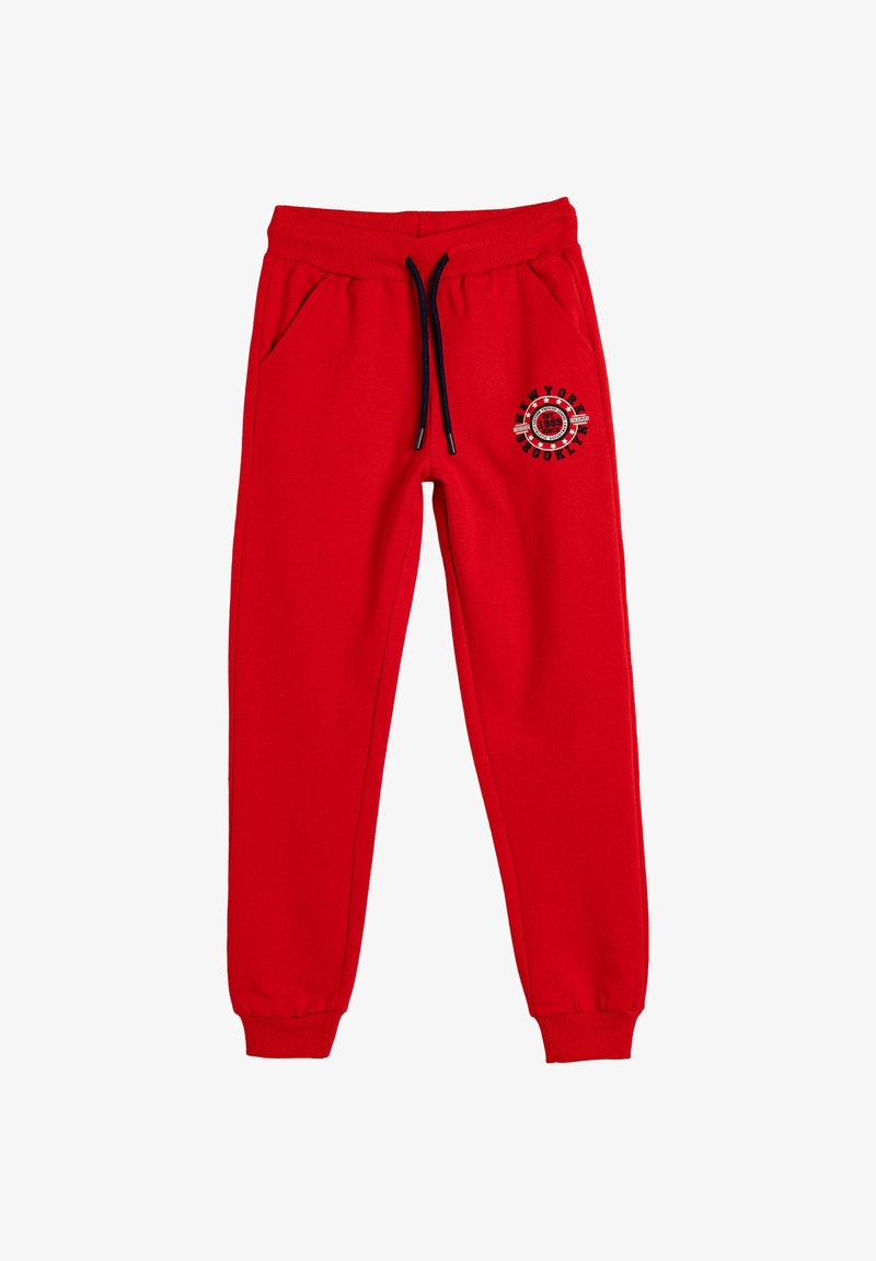 Røde sweatpants i bomuldsblanding med elastisk talje, snøre og sidelommer; har et cirkulært grafisk design på det ene ben.