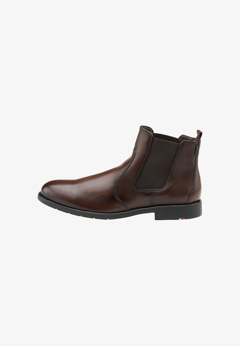 Bottes chelsea en cuir marron avec des panneaux élastiques sur les côtés et une finition lisse. Dotées d'une semelle en caoutchouc et de détails de couture minimaux.