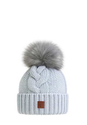 Light gray knitted winter hat with a braided pattern, wide ribbed cuff, brown leather tag, and large fluffy gray pom-pom on top.