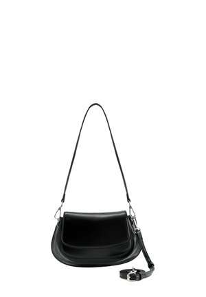 Black leather shoulder bag with flap closure, detachable long strap coiled at the base, and silver-tone hardware on a white background.