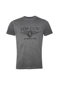 Harmaa puuvillapaita, jossa on pyöreä kaula-aukko, lyhyet hihat ja painettu graafinen kuva, jossa lukee "TOP GUN AMERICAN ICON" sekä siipimäinen suunnittelu.