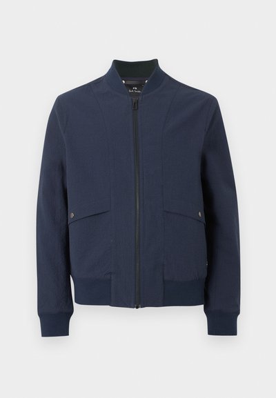 Veste bomber bleu marine avec fermeture éclair à l'avant, col, poignets, ourlet côtelés et deux poches à rabat avec boutons pression.