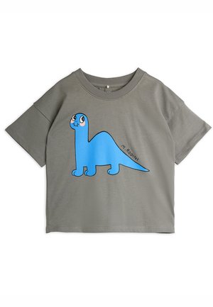 T-shirt gris à manches courtes avec un grand graphique de dinosaure cartoon bleu aux yeux expressifs, fabriqué en tissu coton doux.