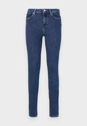 Skinny jeans van donkerblauwe denim. Voorzien van vijf zakken, riemlussen en een ritssluiting met knoopsluiting. Glad oppervlak, minimale stikdetails.