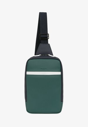 Groene en marineblauwe schoudertas met een gestructureerd oppervlak, witte streepdetails en een verstelbare schouderriem; beschikt over een ritssluiting en een strak ontwerp.