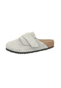 Grey slip-on shoe with a textured suede exterior, adjustable velcro strap, cork accent on the heel, and black rubber sole.