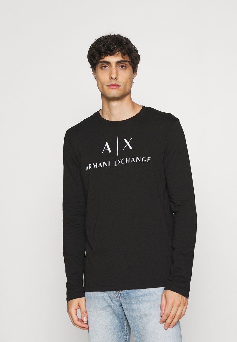 Black long-sleeve shirt made of cotton, featuring a white "Armani Exchange" logo across the chest and a round neckline.