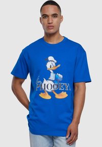 Blå bomull T-skjorte med et bilde av en tegneseriandue. Teksten sier "PHOOEY!" i fete hvite bokstaver under designet. Korte ermer.